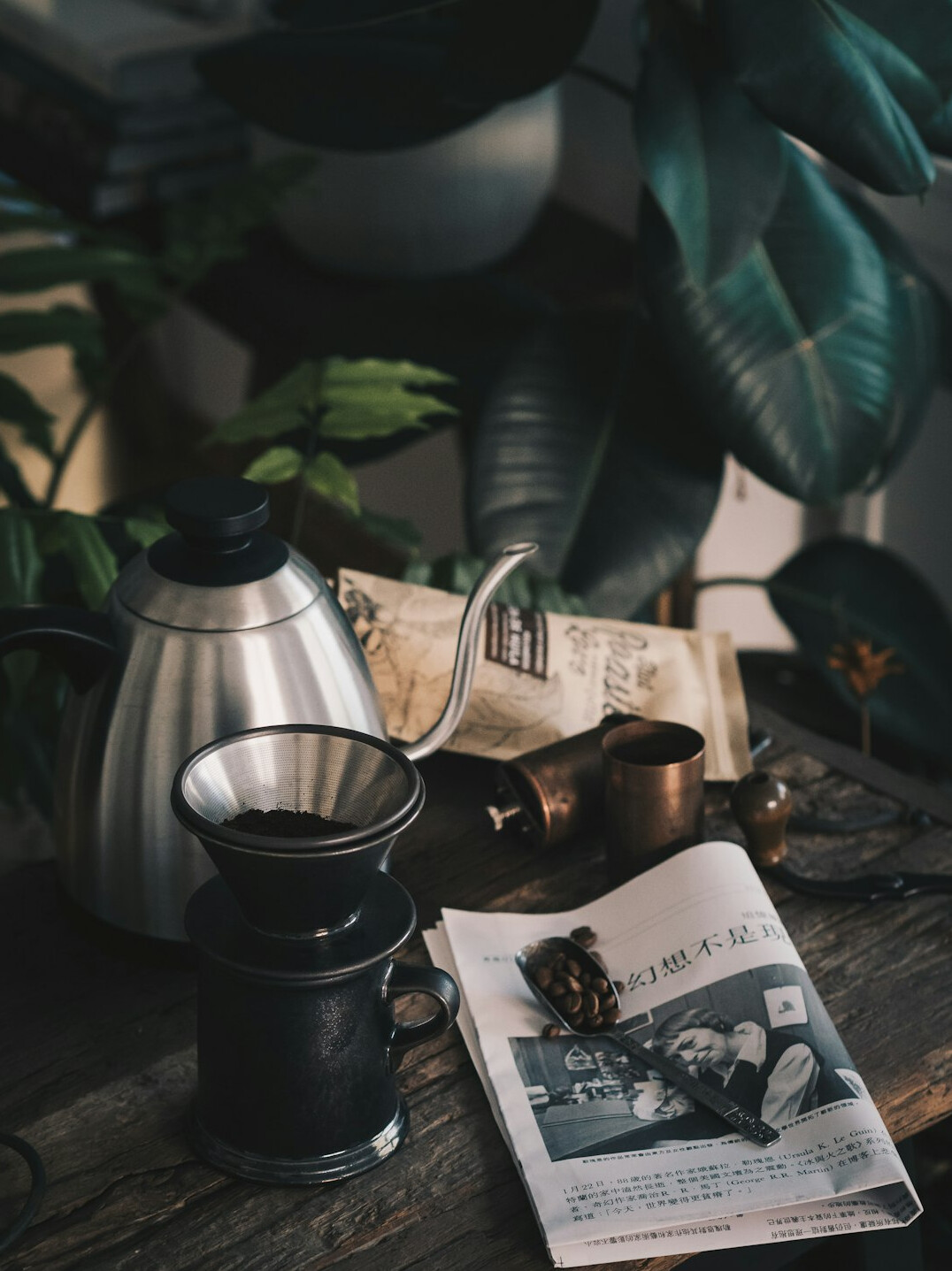 Newspapers and a coffee cup on a desk in a newsroom